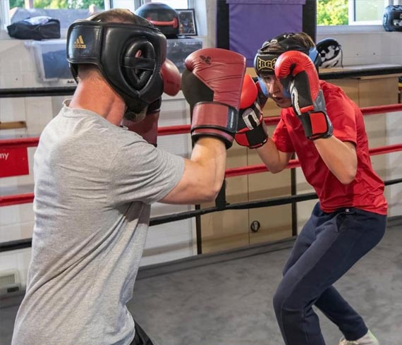 Two men sparring in a boxing ring